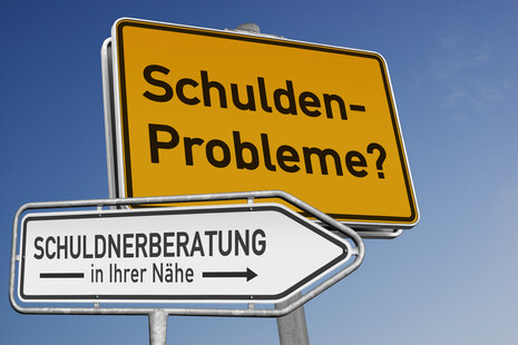 Zwei Schilder Schuldenprobleme/Beratung